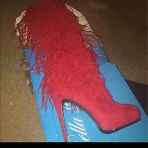 Knee high fringe boots